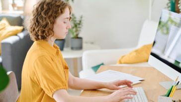 woman working on a computer at a desk