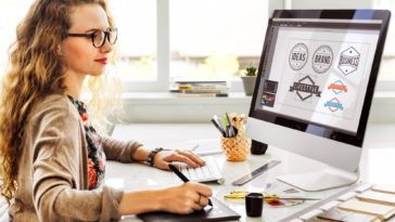 woman working on designing logos on a computer