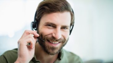 smiling man with a headset