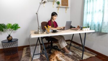 woman working at a desk on a laptop at home