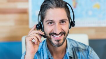 smiling man wearing a headset